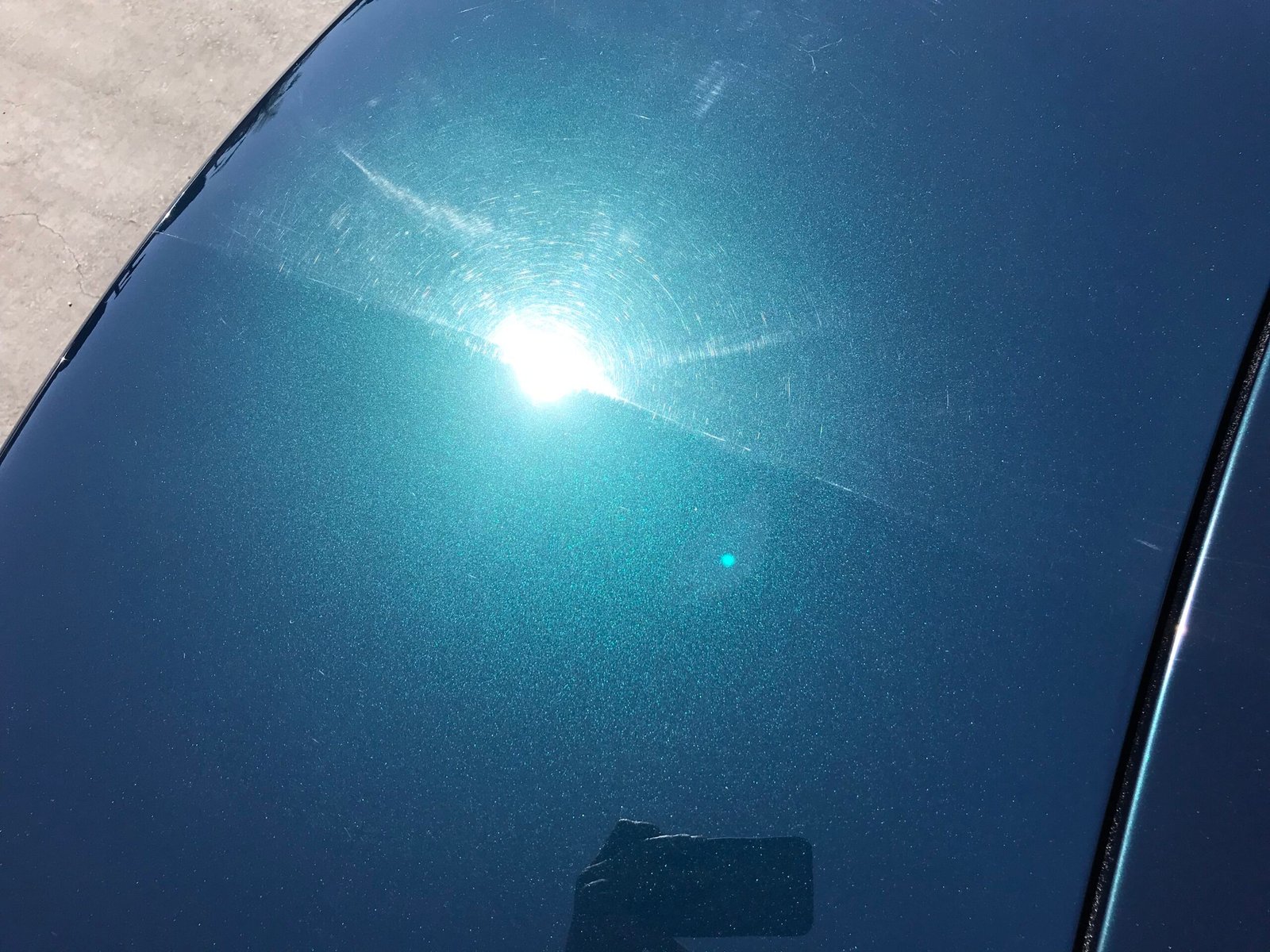 Professional paint correction demonstration on vehicle paint